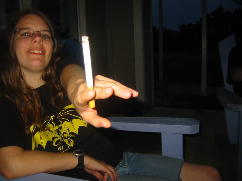 20030810 - Broadkill Beach with Dan & Erin - 100-0023 - Carolyn passing the cigarette