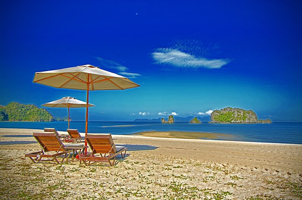 The sun, sea, moon and a pair of parasol.....