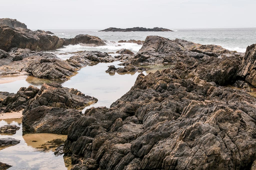 Rock pools forming as the tide moves out, Sawtell Beach, NSW
