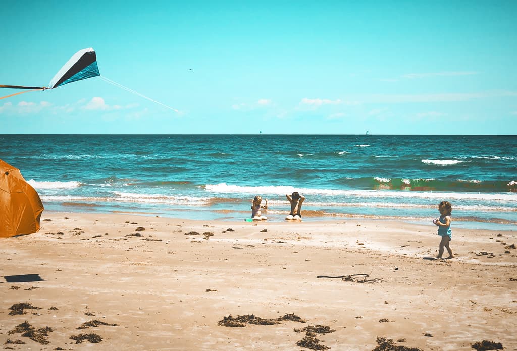 Toddler flying a kite on the beach #jcutrer