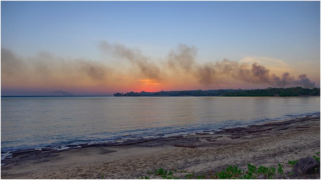 Sunset & bushfire over Fannie Bay & East Point, Darwin Harbour, NT, Australia