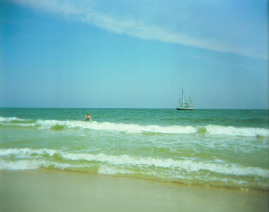 and watches the ships as they go sailing