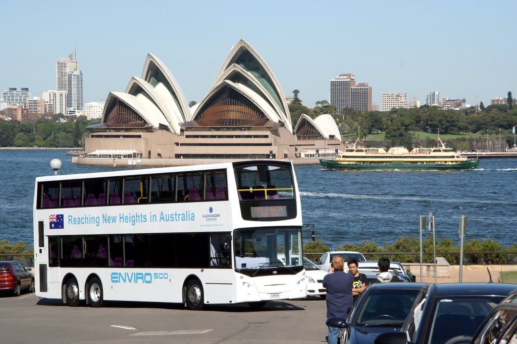 I.D.s 60 & 21776 photographed by John Ward on 2008-04-26 of Alexander Dennis Enviro 500 C49958 and the ferry Queenscliff passing the Sydney Opera House, Broughton Street at Olympic Drive, Kirribilli, Sydney, N.S.W., Australia.
