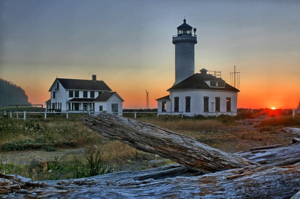 Setting Sun Behind Lighthouse