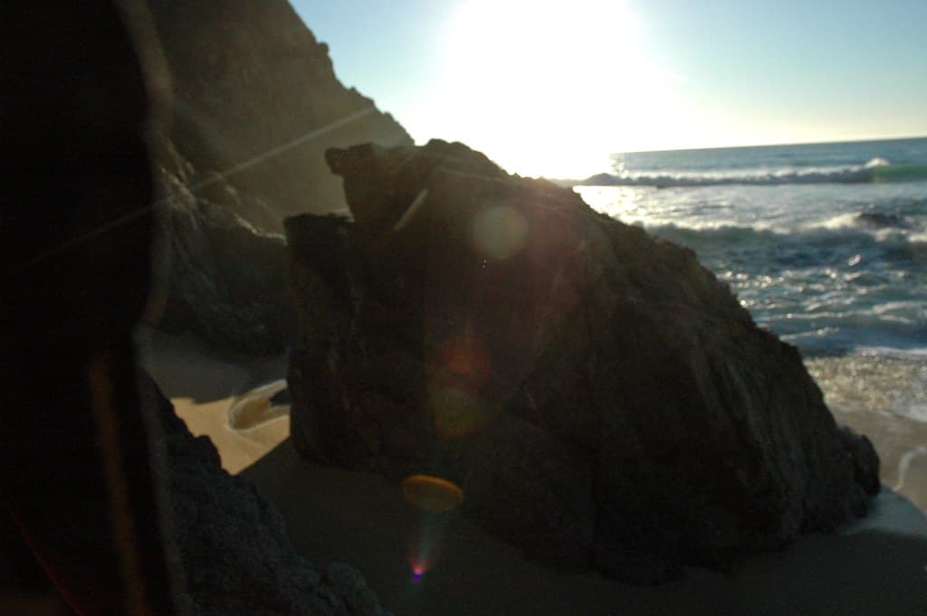 The perfect natural solar lens flare with a pink diamond tip, drops, and cool pearls, Gray Whale Cove, California, USA