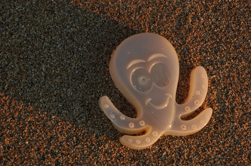 Plastic octopus thrown back by the Pacific Ocean at Gray Whale Cove, California Coast, USA