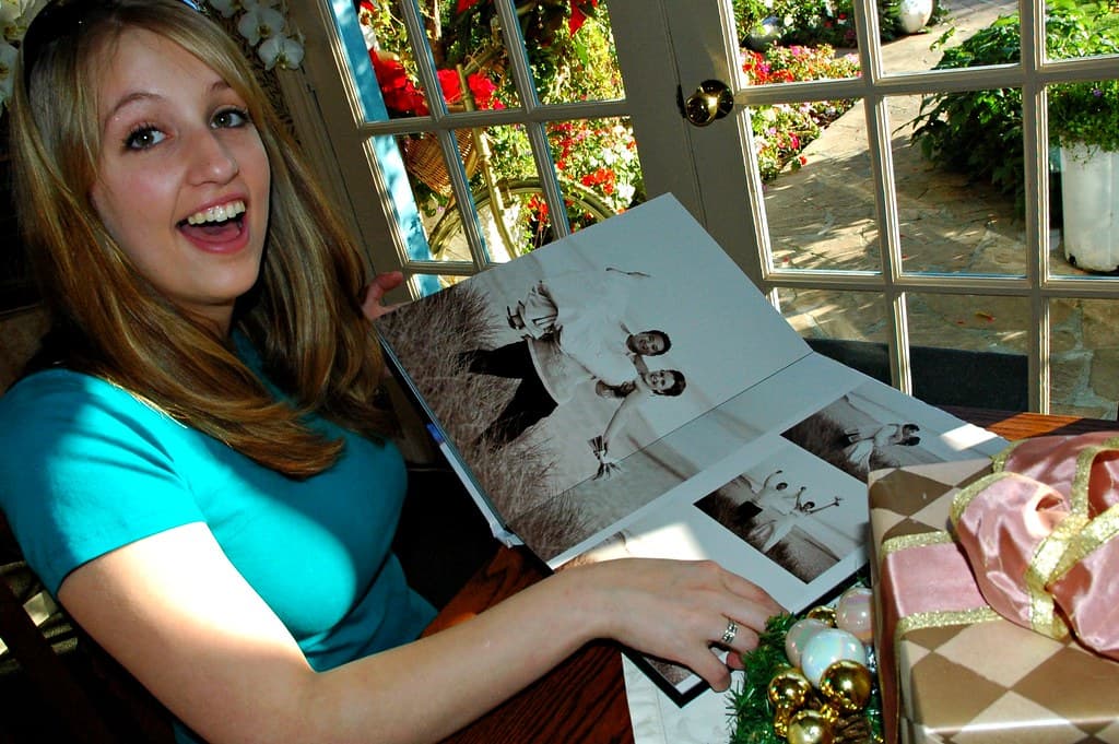 Surprise, Jessie Rabbit checks out a wedding album, Mill Rose Inn, Half Moon Bay, California, USA