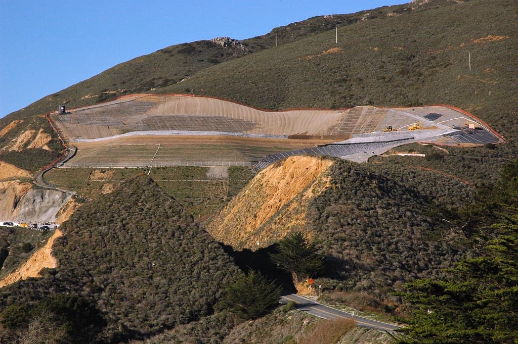 Gaia; Just south of San Francisco on highway 1 is a huge project digging a tunnel, and into mother earth, which has already been cut open to allow the highway to shoot though. This is directly above Gray Whale Cove, one of the free beaches in California
