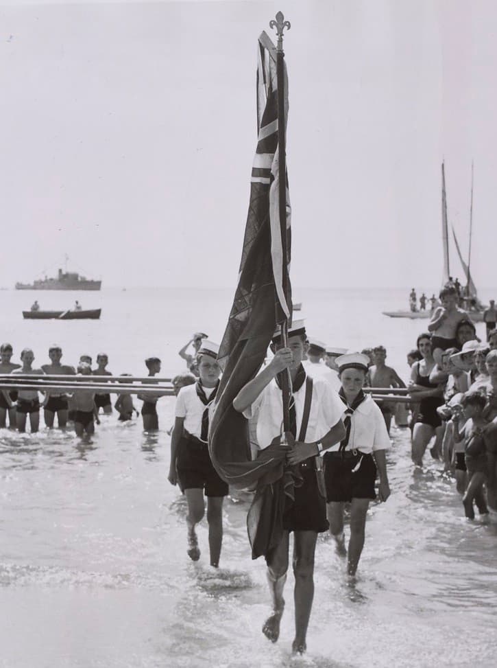 Sea Scouts [carry the Australian flag at the Australia Day ceremony at Frankston