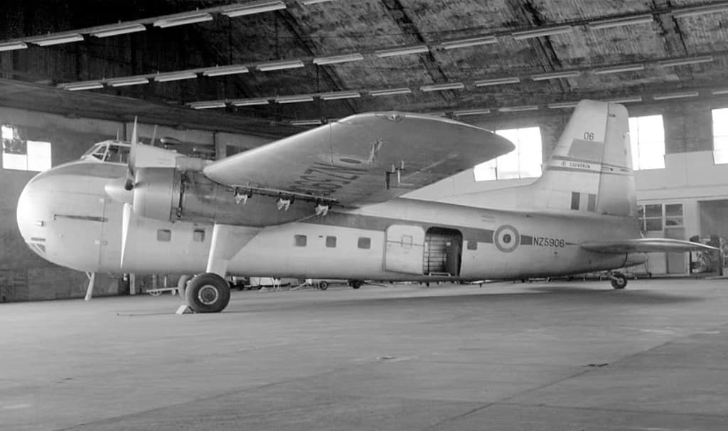 1964 RNZAF Bristol Freighter NZ5906 in No. 1 hangar at Whenuapai, Auckland, having just arrived from Singapore (departed 18 Aug). The patch on the fin is the painted over 'Operation Scorpion' emblem, 23 Aug 1964.