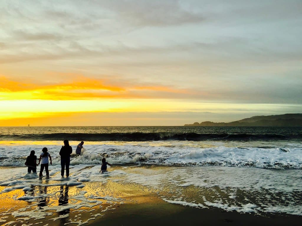family frolic in tide, baker beach sunset