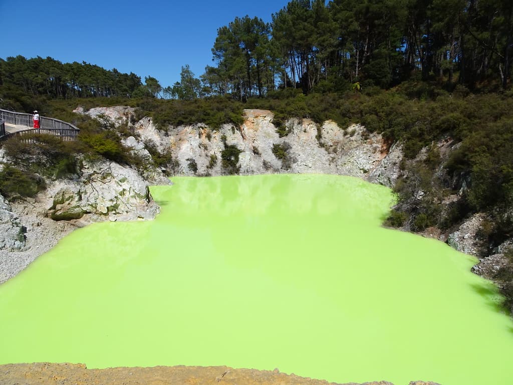 Rotorua. Wai-O-Tapu geothermonal park. This is one of many coloured lakes where this one is coloured yellow by sulphur. This area is part of the Taupo volcanic zone of New Zealand.