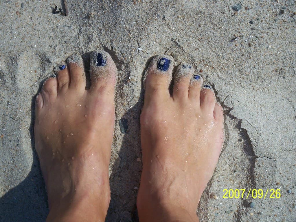 Blue toes in the sand
