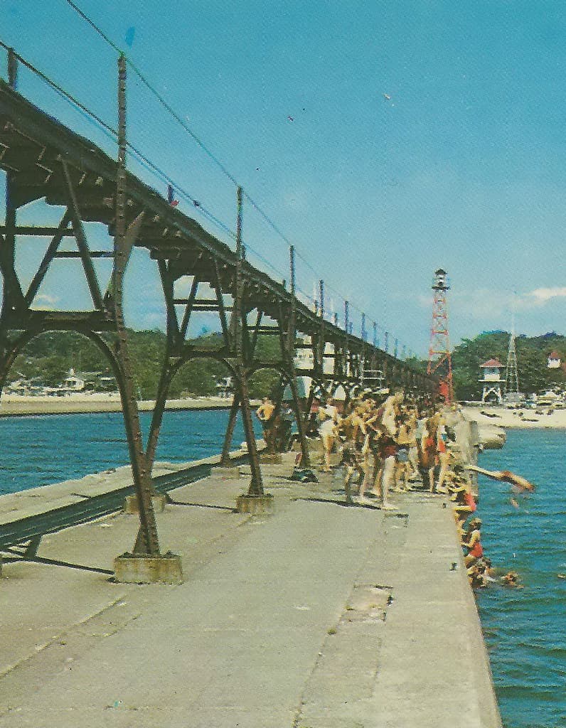SW South Haven MI 1950s Lighthouse Catwalk Swimming & Vacation FUN Public Beach City Power Plant & USCG Station in background Photographer Unknown LL Cook Card-