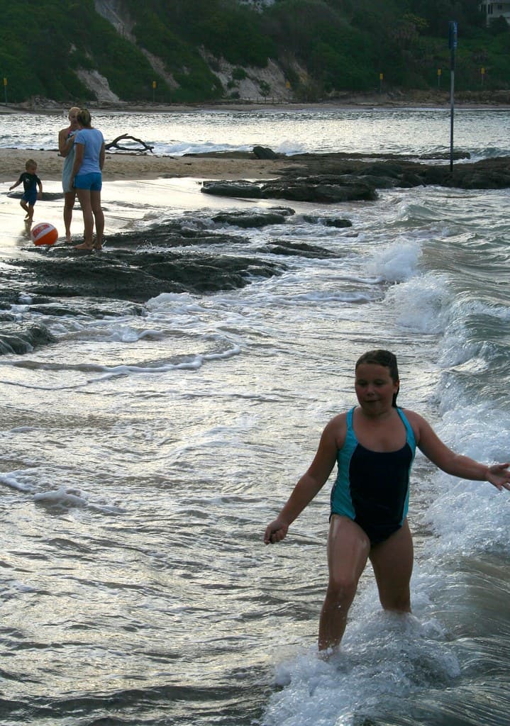 Enjoying the surf at high tide - Norah Head Rockpool at Sunset