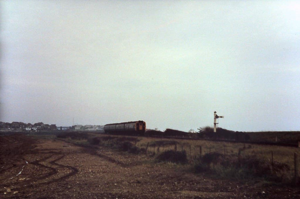 8X-112 With a sea mist closing in, a 4-CIG unit crosses the salt marshes at Tide Mills