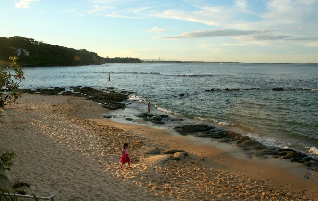 A child plays on the beach - Norah Head Rockpool at Sunset