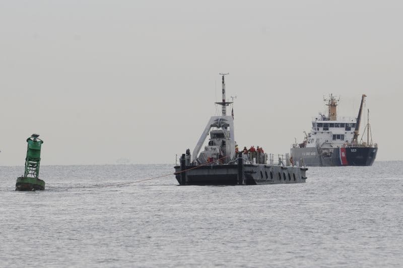 Coast Guard, Navy removes buoy from beach