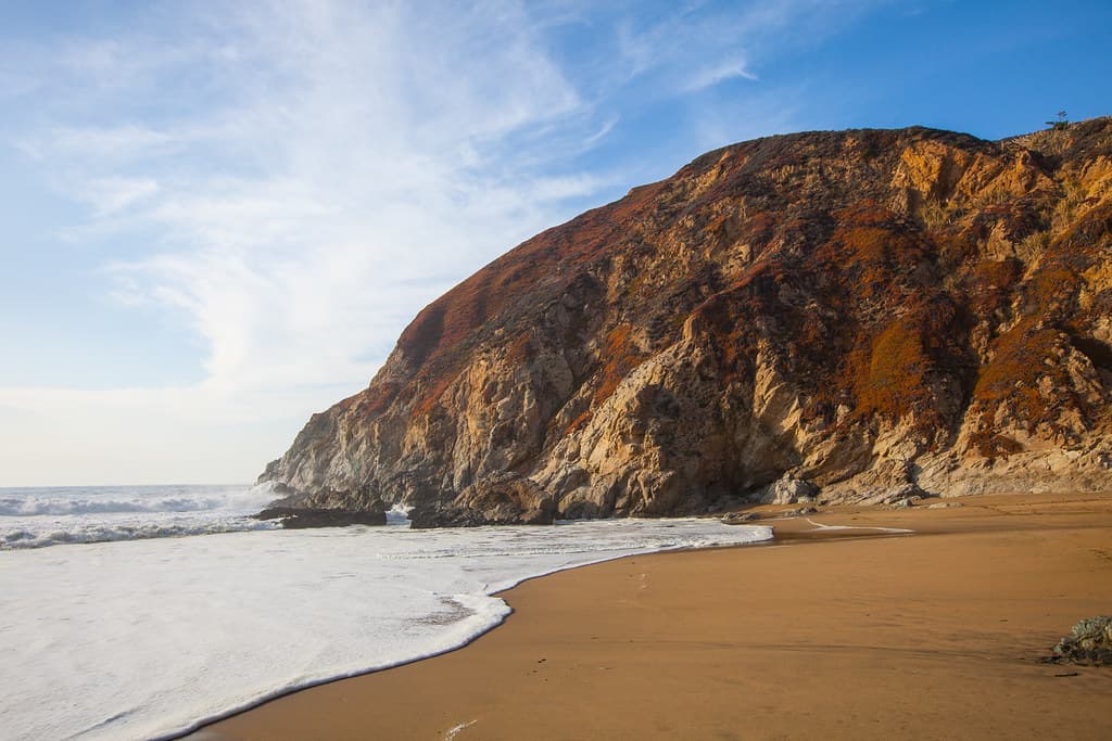 Looking up at the hills from the beach at Gray Whale Cove State Beach.