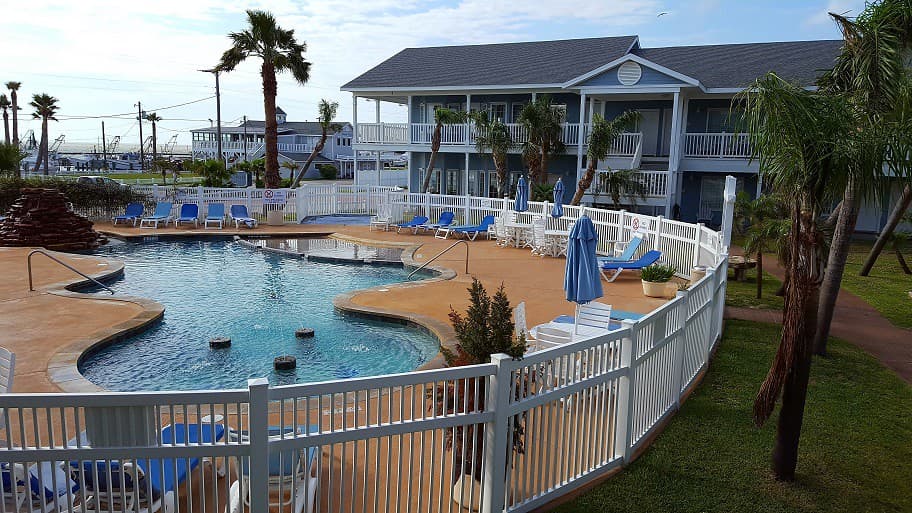 The Inn at Fulton Harbor looking across the pool toward the marina