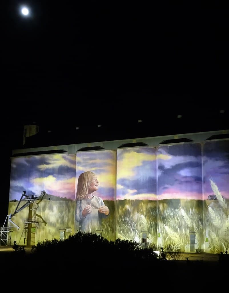Kimba on Eyre Peninsula. A full moon and lights light up the Kimba silo art.
