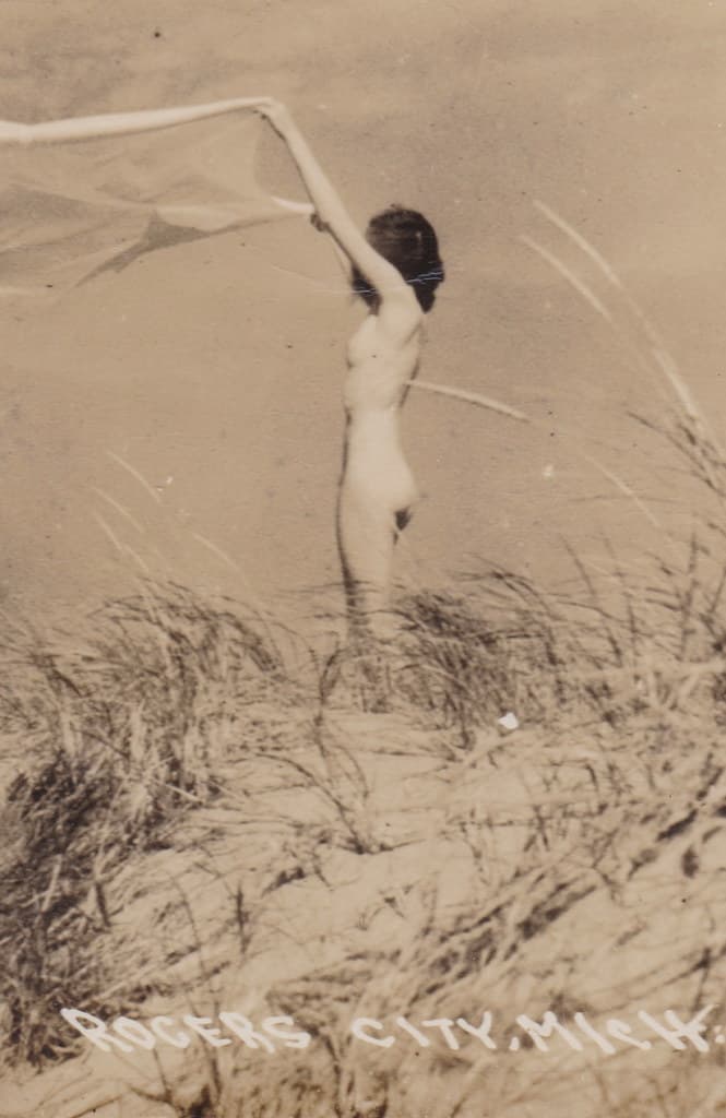 NE Rogers City MI 1950s RPPC LL COOK lively, entertaining, and mildly titillating Nude Pretty Gal on the Lake Huron Beach Travel and Tourism Card Vacation FUN on the Sunrise Side-