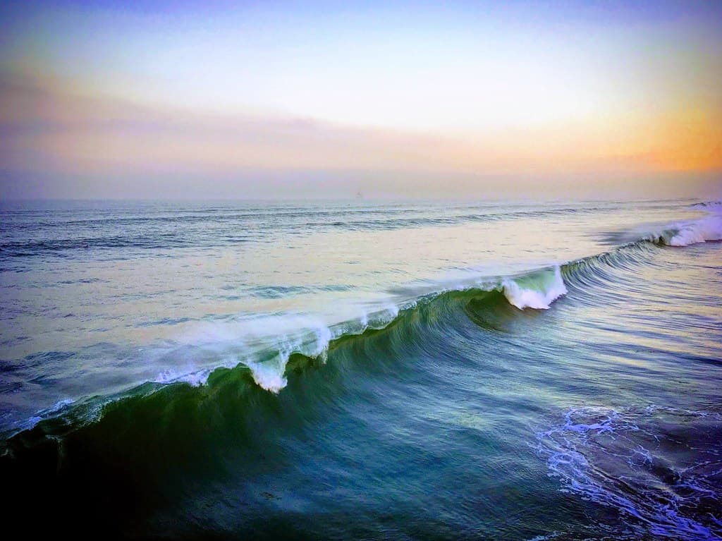 Vibrant ocean wave crushing at twilight near Huntington Beach, California, USA, January 2019