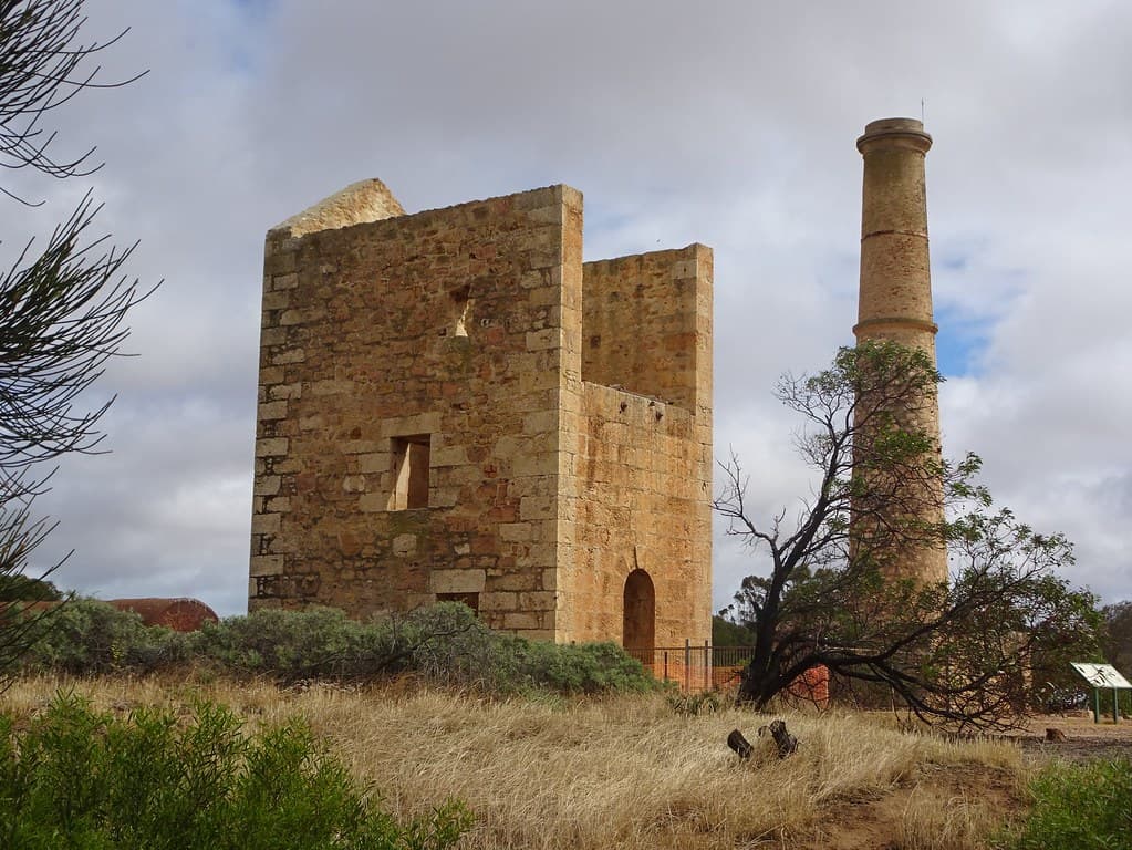 Moona Mines  copper mining site. Hughes Enginehouse built 1865 and the Hughes Boiler House and chimney built 1865. Nearby the Hughes, Elder and Barr Smith shafts. Three boilers imported from Cornwall.