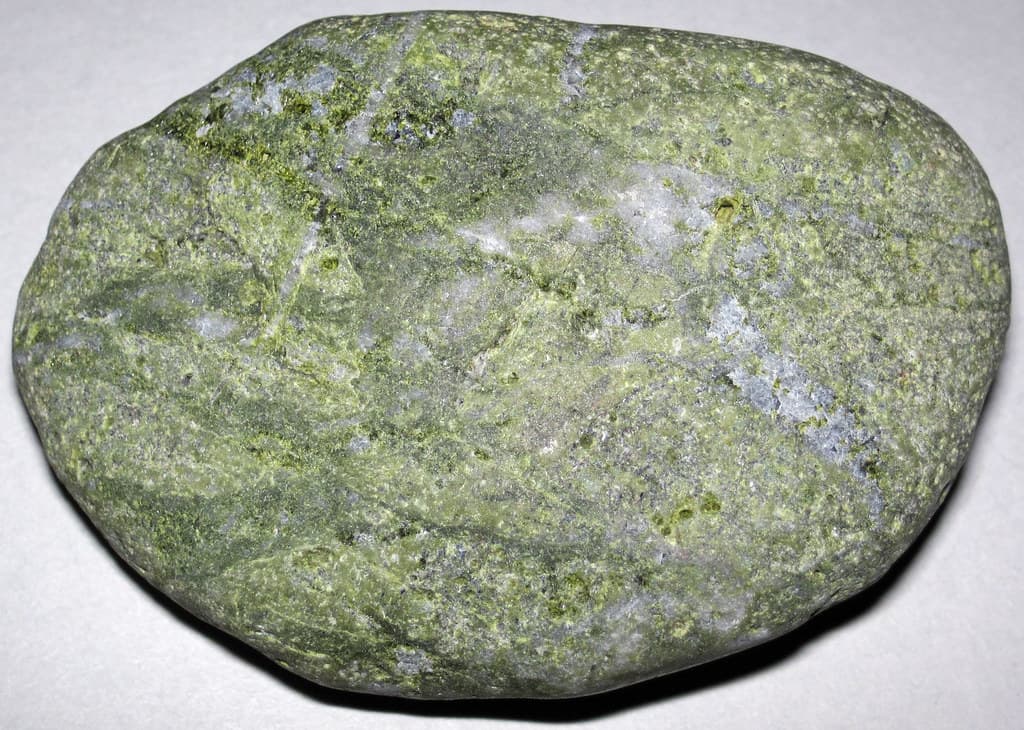 Epidote-rich cobble (Northeastern University Marine Station, Nahant Peninsula, Massachusetts, USA)