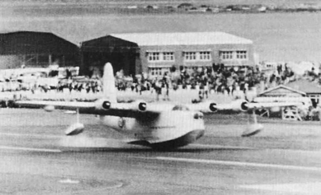 Sunderland 'M' NZ4113 does a 'touch and go' during the Opening Day Airshow at Wellington International Airport, Rongotai, Wellington, Sunday 25 Oct 1959.