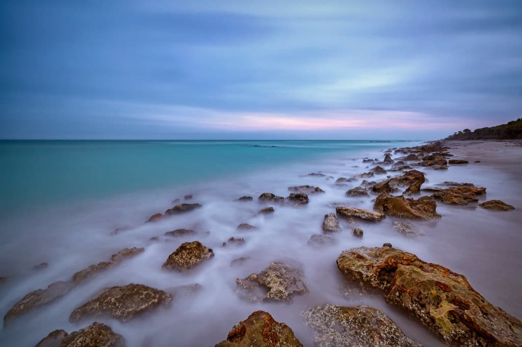 Long exposure of cloudy morning just before sunrise on Caspersen Beach near South Venice, Florida