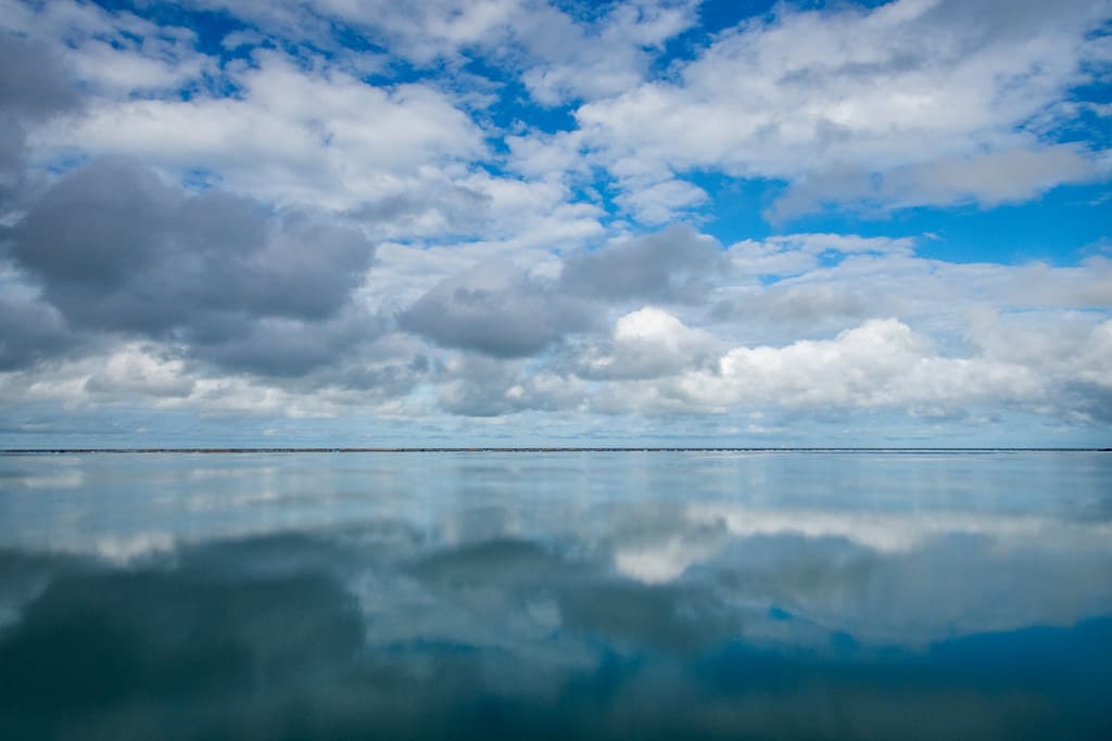 The pool and the Coral Sea and the sky (low angle), Newell Beach, Far North Queensland