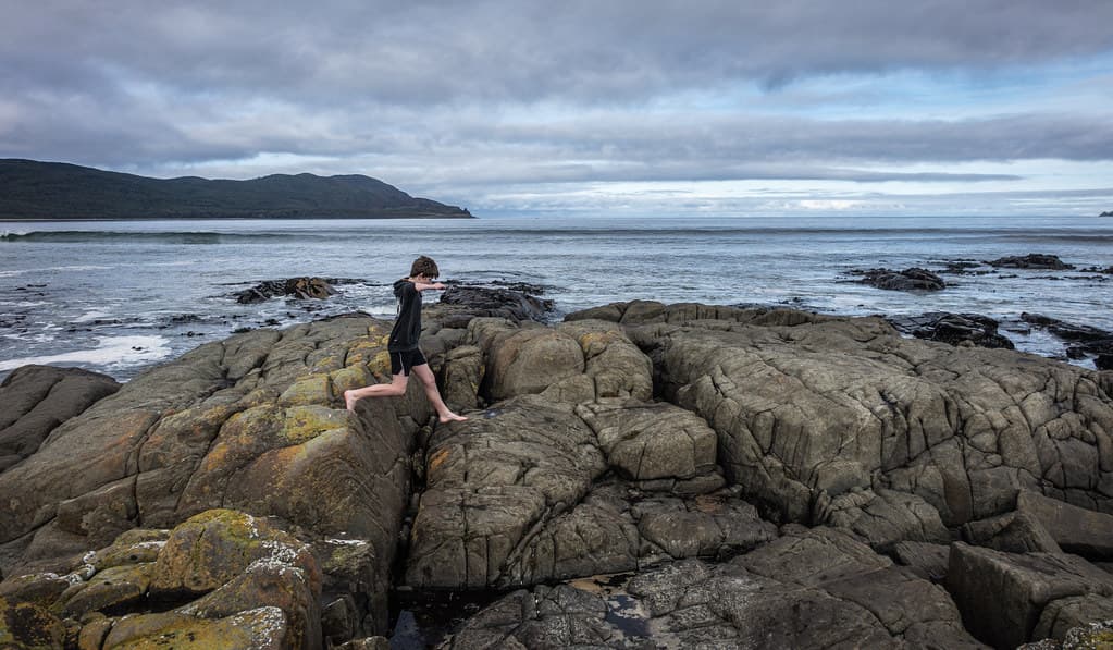 Ezra rock hops, Cloudy Bay, Bruny Island, Tasmania