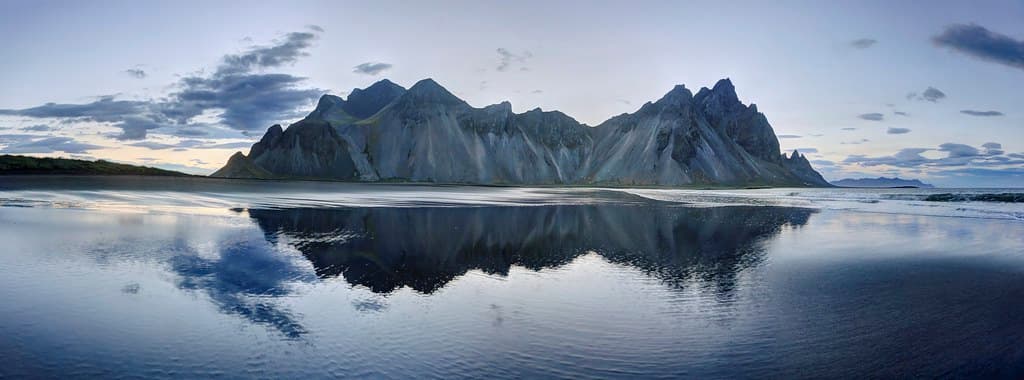 Walking along the beach near the Vestrahorn Mountains