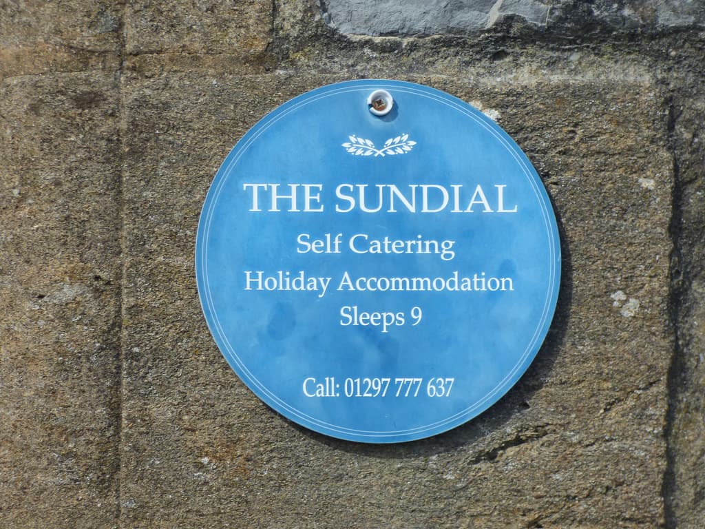 The Sundial - Marine Parade, Lyme Regis - blue sign