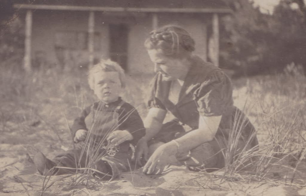 NW Arcadia MI RPPC c.1918 LITTLE GEORGE son of Ray & Anna Edwards on the beach in front of a Arcadia Waterfront Cottage Photo by Hardware Store Manager & Photographer Ray Edwards1