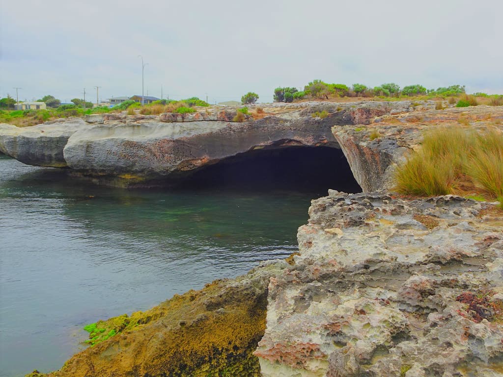 Blackfellow Caves. A small coastal town on the limestone coast of Sth Australia. Ocean eroded limestone caves under cutting the land.