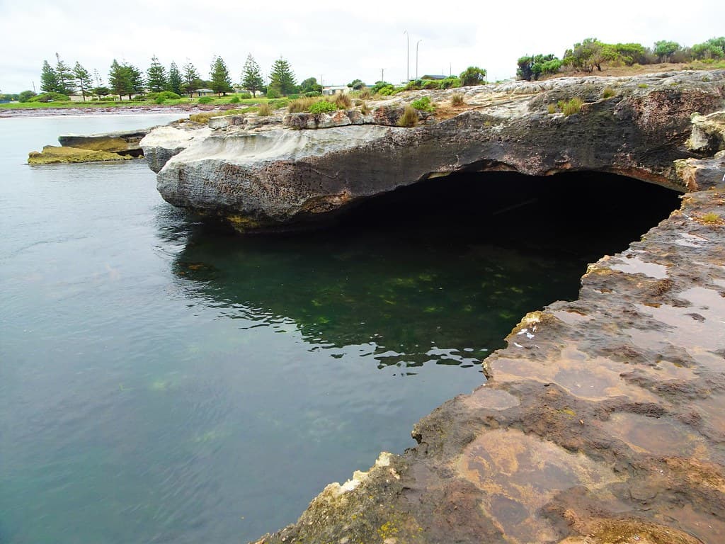 Blackfellow Caves. A small coastal town near Carpenter Rocks SA. Ocean eroded limestone caves under cutting the land.