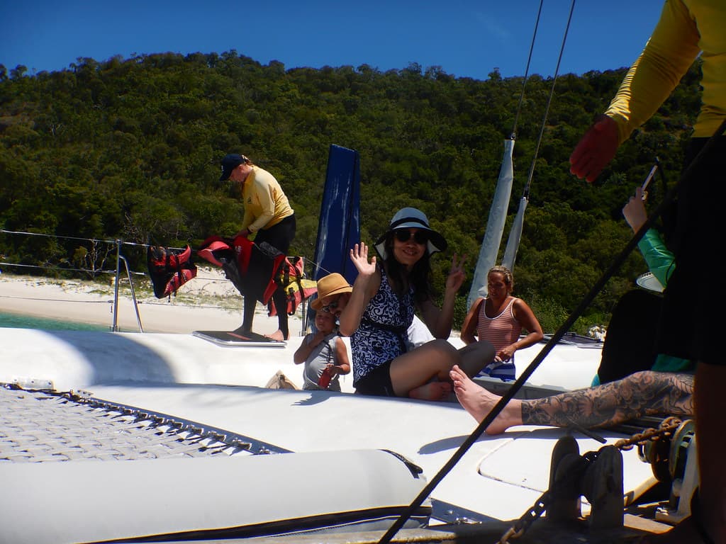 Julia waving goodbye to Chalkies Beach on Haslewood Island