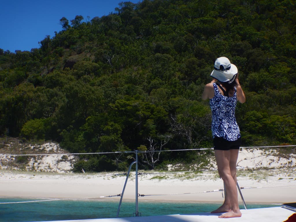 Julia taking photos of Chalkies Beach on Haslewood Island