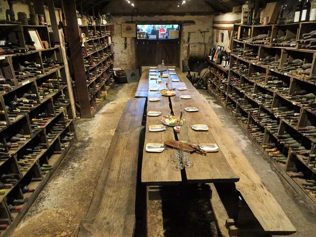 Coonawarra. Brands Laira winery. Lunch table set in the old 19th century cool cellar now enclosed in a modern winery building.