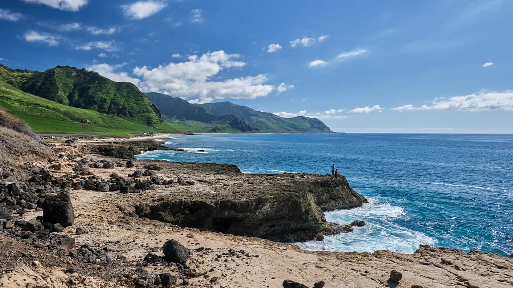 Rocky coastline, with Keawaula Beach in the distance
