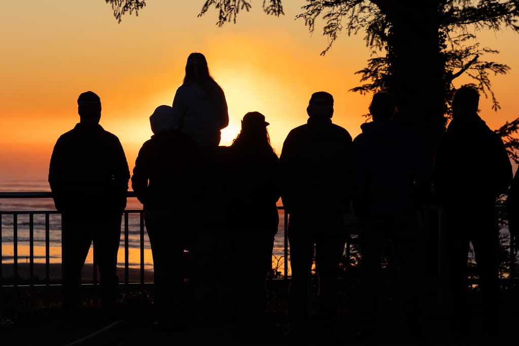 People watching the sunset along the beach