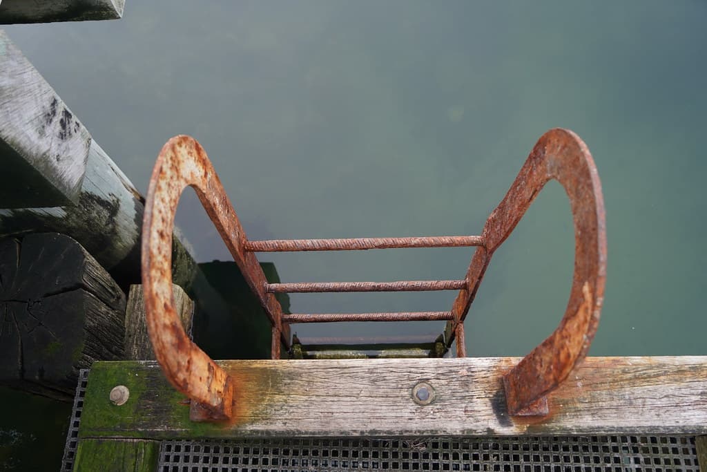 Ladder down to the water at the pier at Half Moon Bay on a Cloudy Winter Saturday