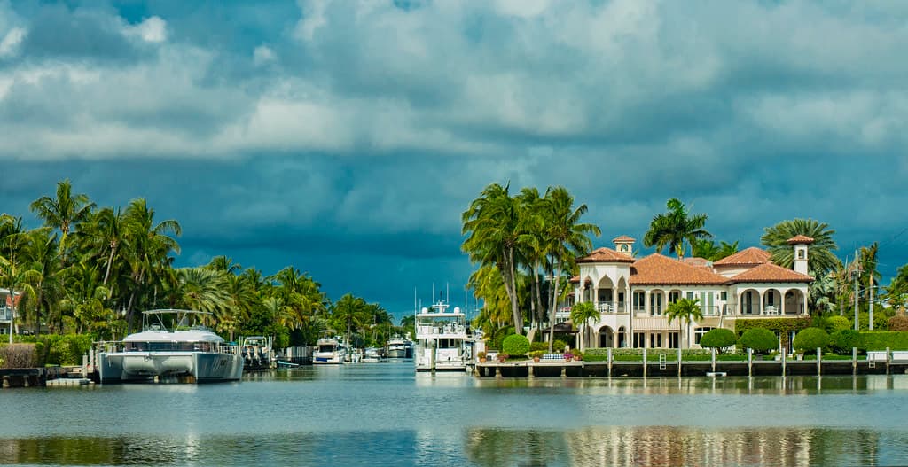 Driving through Las Olas boulevard from the beach to the city center. Views of canals, boats, yachts and architecture of Nurmi Isles neighbourhood of Fort Lauderdale, Florida, USA. Winter trip 2024/25