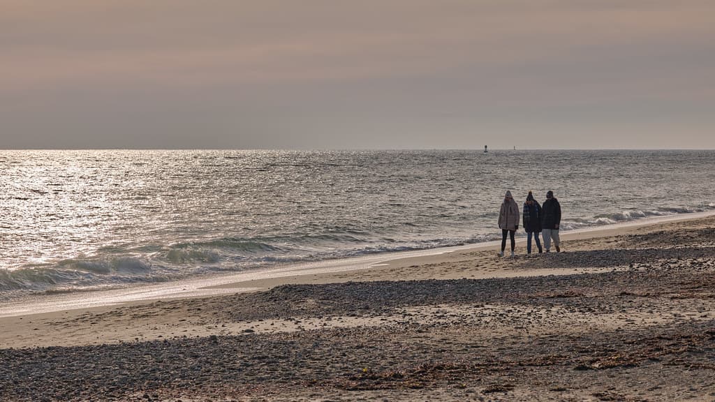 Walkers on the beach at Napatree Point