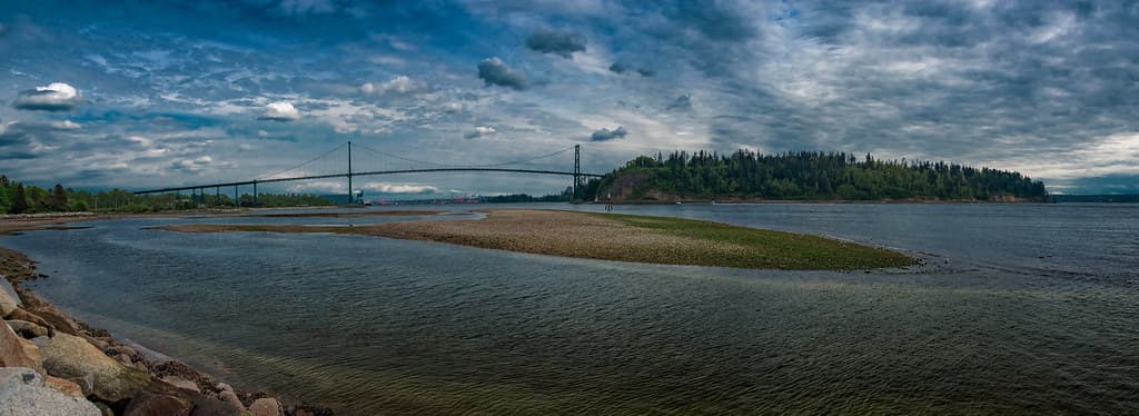 Panoramic of the Lions Gate Bridge & Stanley Park from Ambleside Beach (Vancouver BC, Canada)