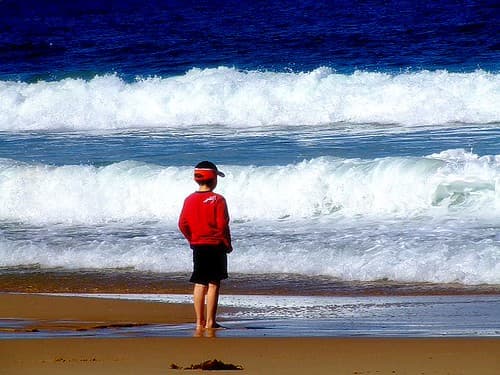 boy on the beach (saturated with shadows)