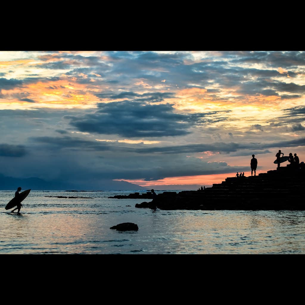 Surfing at Sunset, Senggigi, Lombok, Indonesia
