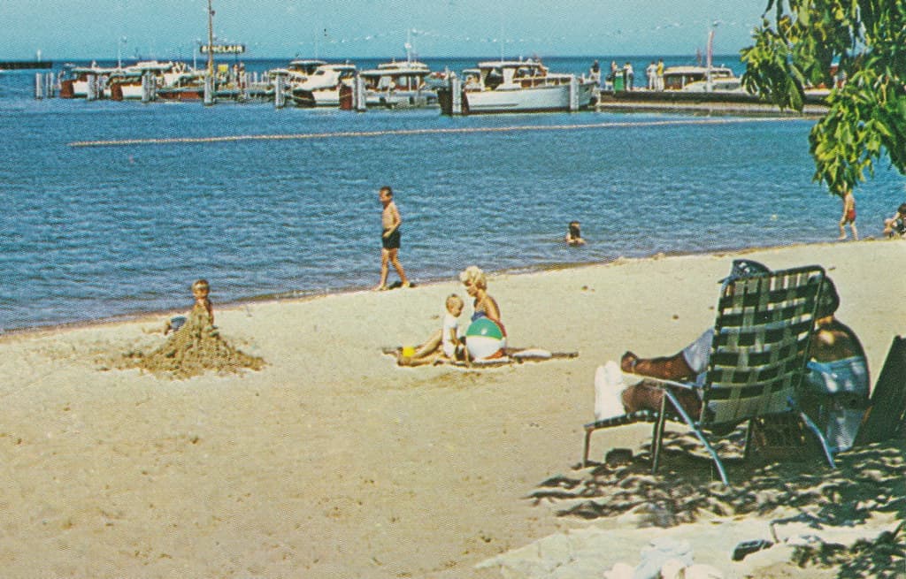 CEN Port Austin MI 1950s SINCLAIR MARINA GAS DOCK BEACH BABES & Vacationing Tourists Port Austin Harbor & Beach Swimming Pier near Port Crescent State Park on Lake Huron Postmarked 1962-